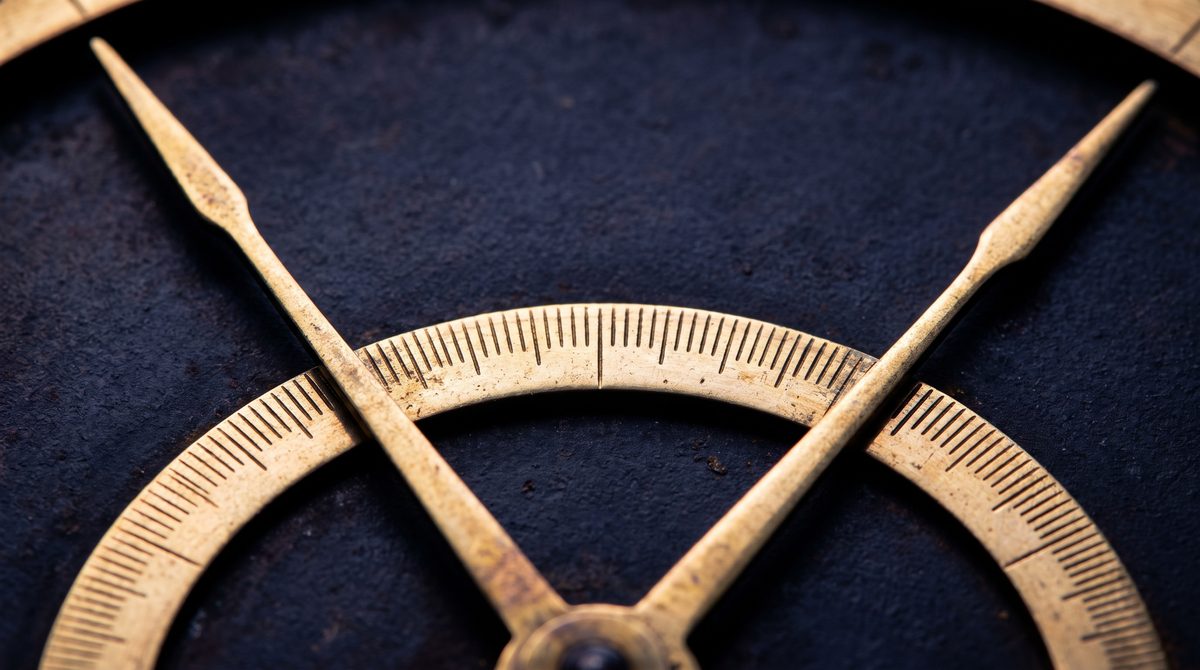 A faint cone of zodiacal light leaning up from a dark horizon
